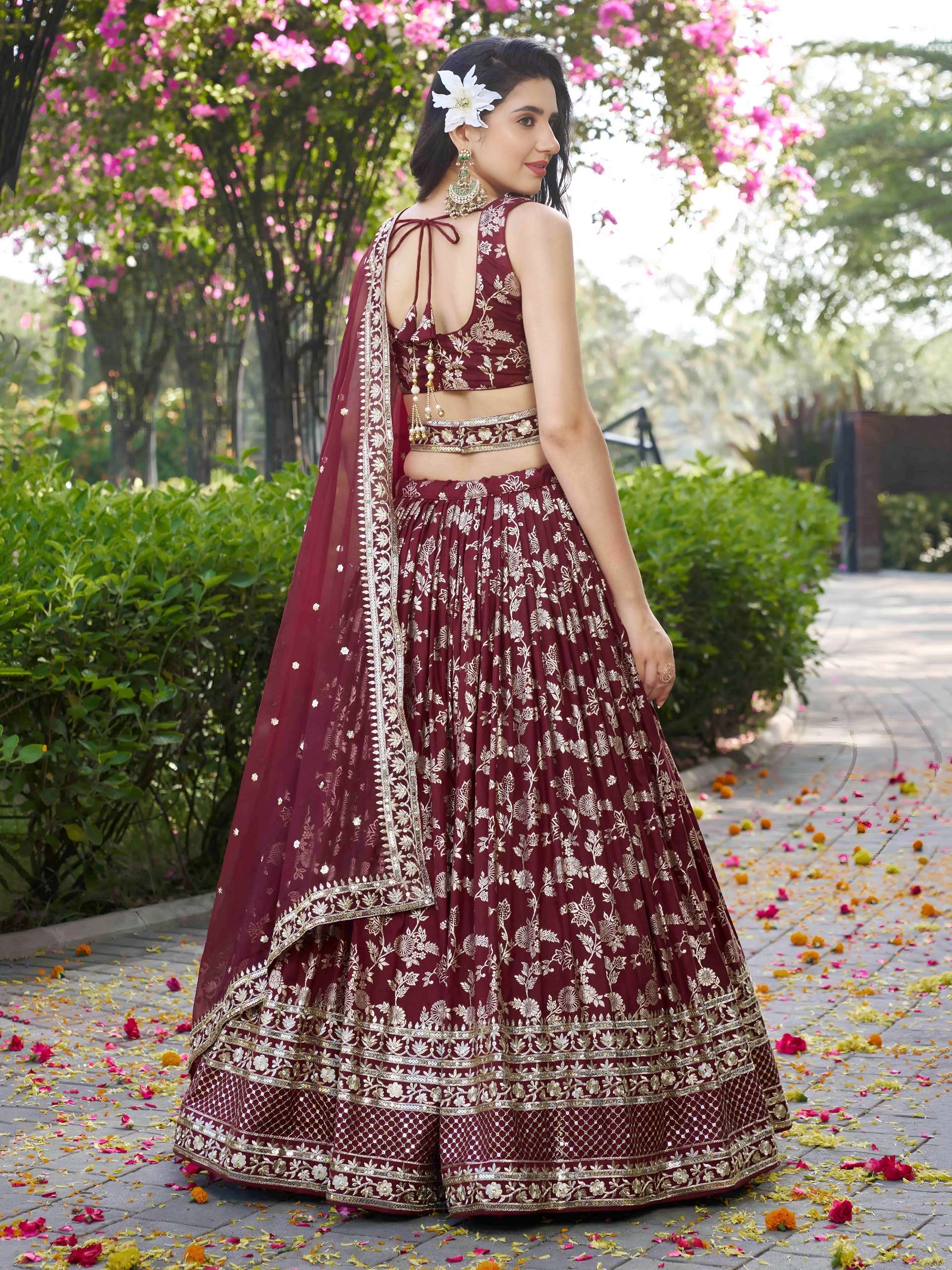 The lehenga is crafted from rich dola silk jacquard fabric in Maroon Garden Royale colour lehenga choli at the best rate 7100 Maroon The lehenga is crafted from rich dola silk jacquard fabric in Maroon Garden Royale colour lehenga choli at the best rate 7100 Maroon